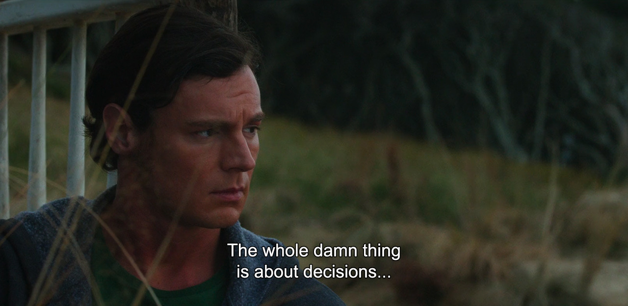 Film still of a man looking distraught with the subtitle reading "The whole damn thing is about decisions..."